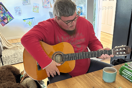 Disabled man playing the guitar