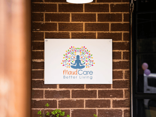 Maudcare sign on front brick wall at Corio facility