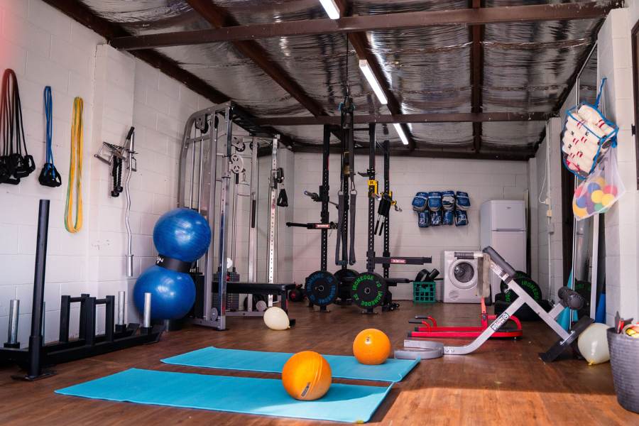 Gym facilities at Maudcare with yoga mats, exercise balls and other gym equipment