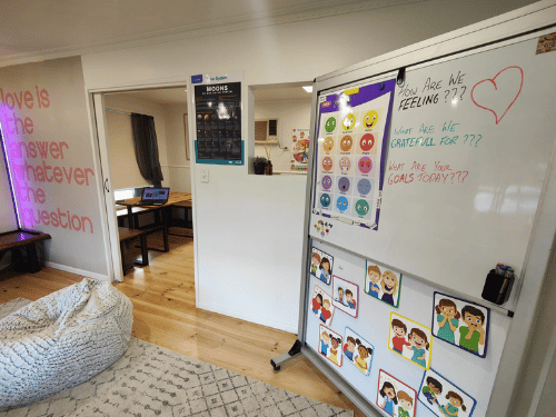 Living room at Corio facility with whiteboard