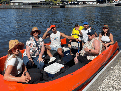 Group of support workers and NDIS participants in boat