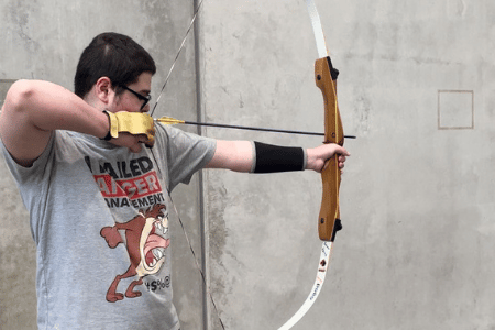 Disabled man in archery class