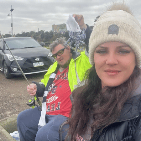 A man and a woman fishing