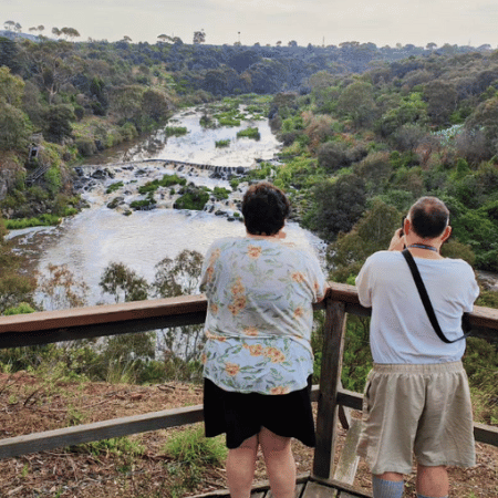 A man and a woman looking at the scenery