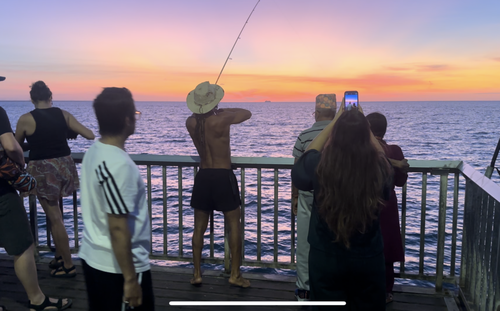 Group of people on a fishing pier