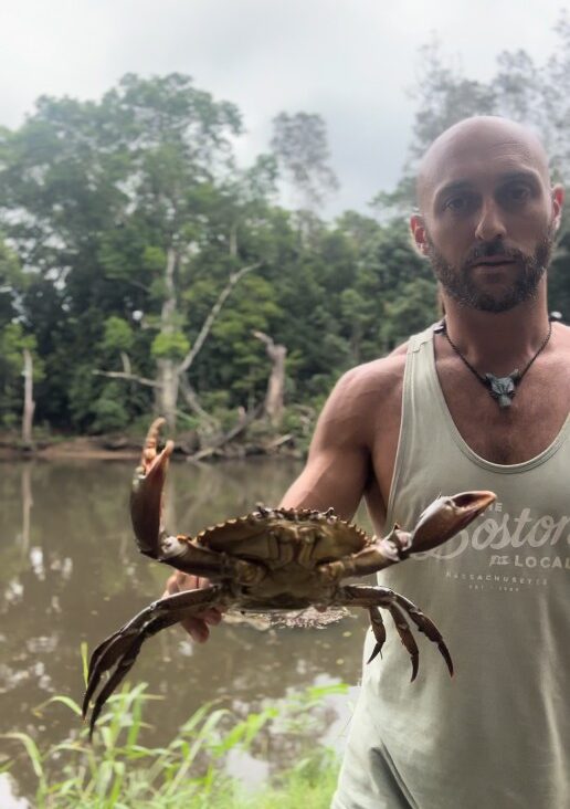 A man holding a crab