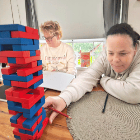 A woman playing jenga